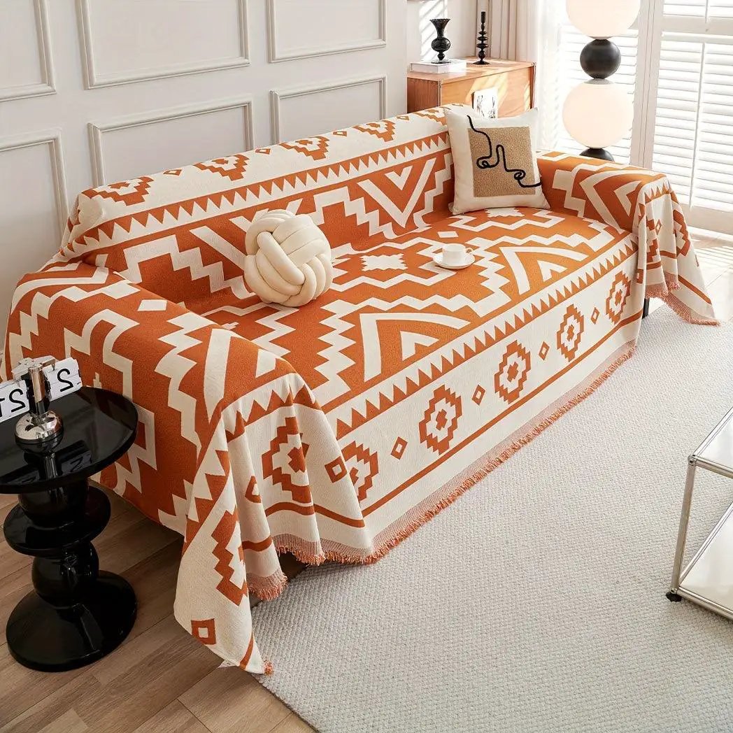 Boho-Chic All-Season Sofa Cover by topspet in orange and cream geometric print