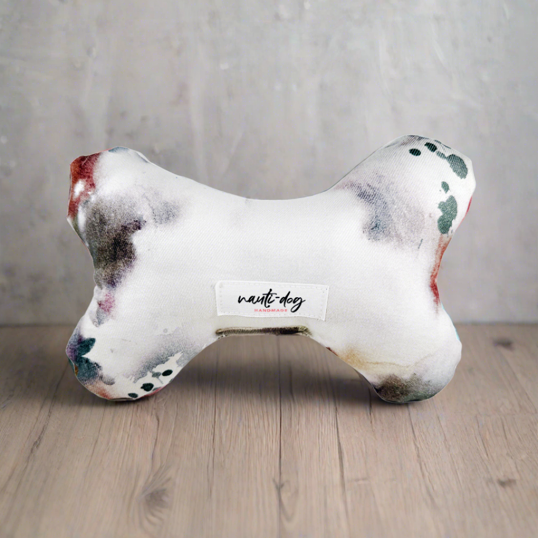 Chic Denim Deluxe Squeaky Dog Toy by For Animals, With Love; bone-shaped plush in white fabric with watercolor patches