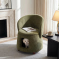 Load image into Gallery viewer, Green pet-friendly chair with hidden pet nook, a small white dog peeks out.
