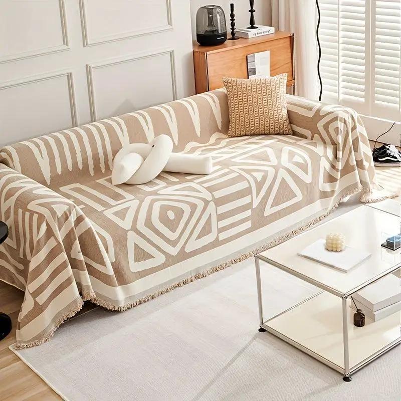 Bohemian-Style Chenille Couch Cover, extra-long beige with white geometric pattern, protects sofa from dog scratches