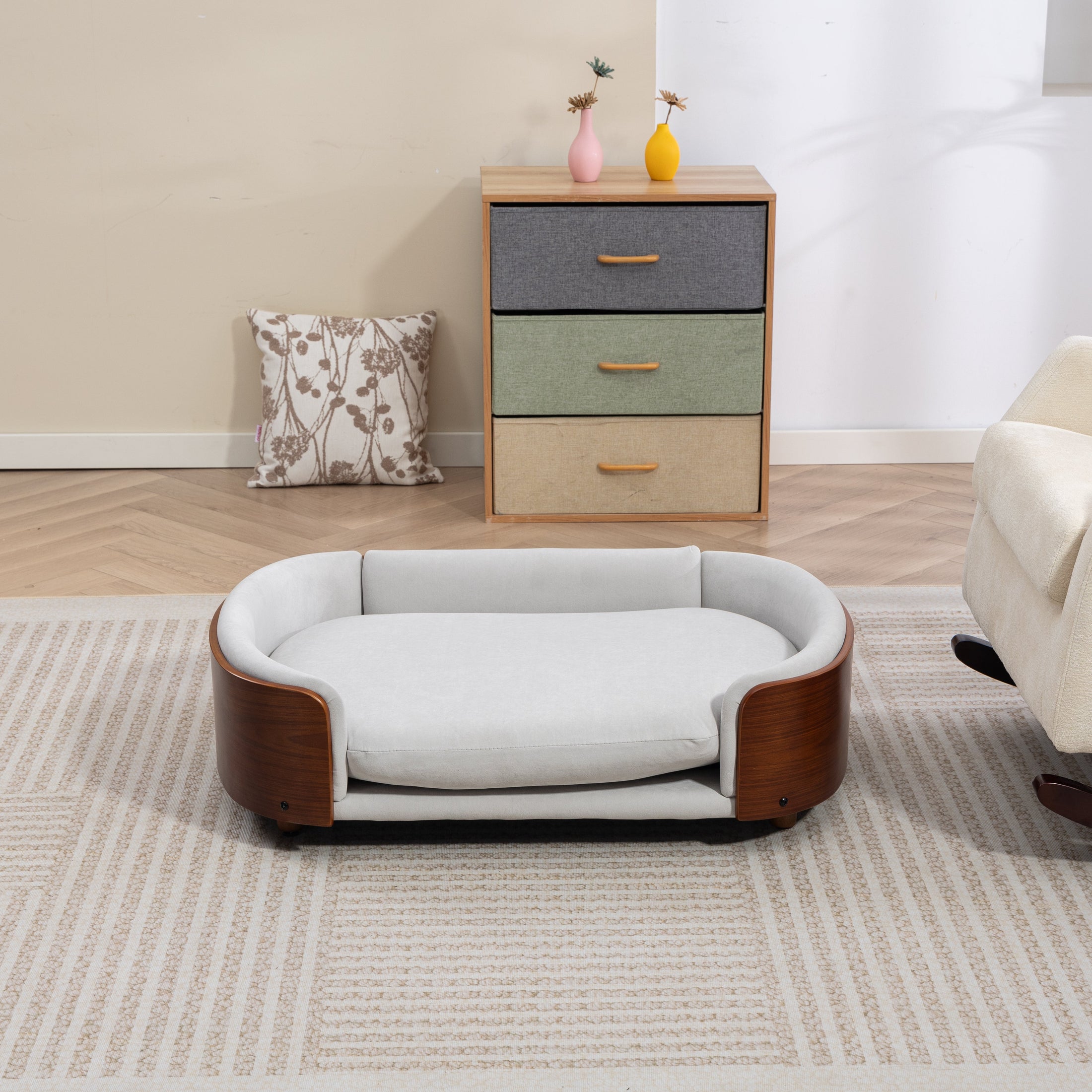 Scandinavian Style Elevated Dog Bed by Home Furnishers with solid wood legs and light grey upholstery
