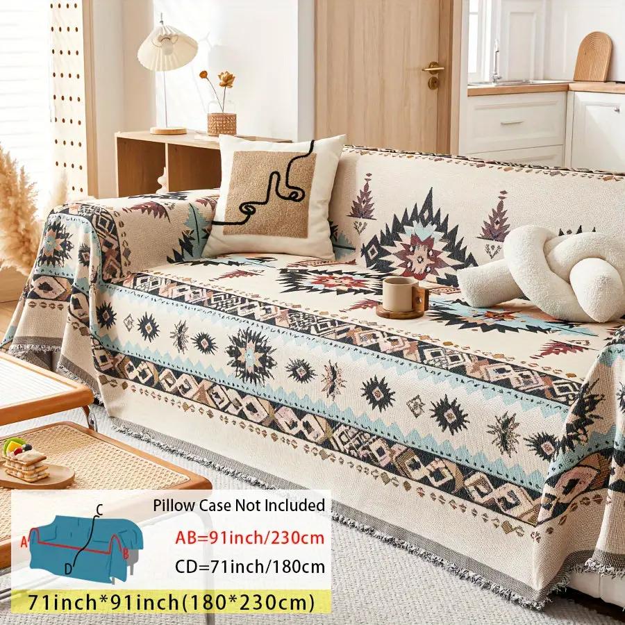 Extra Large Sofa Cover by topspet; stretchable furniture protector in blue-beige geometric pattern on a sofa.