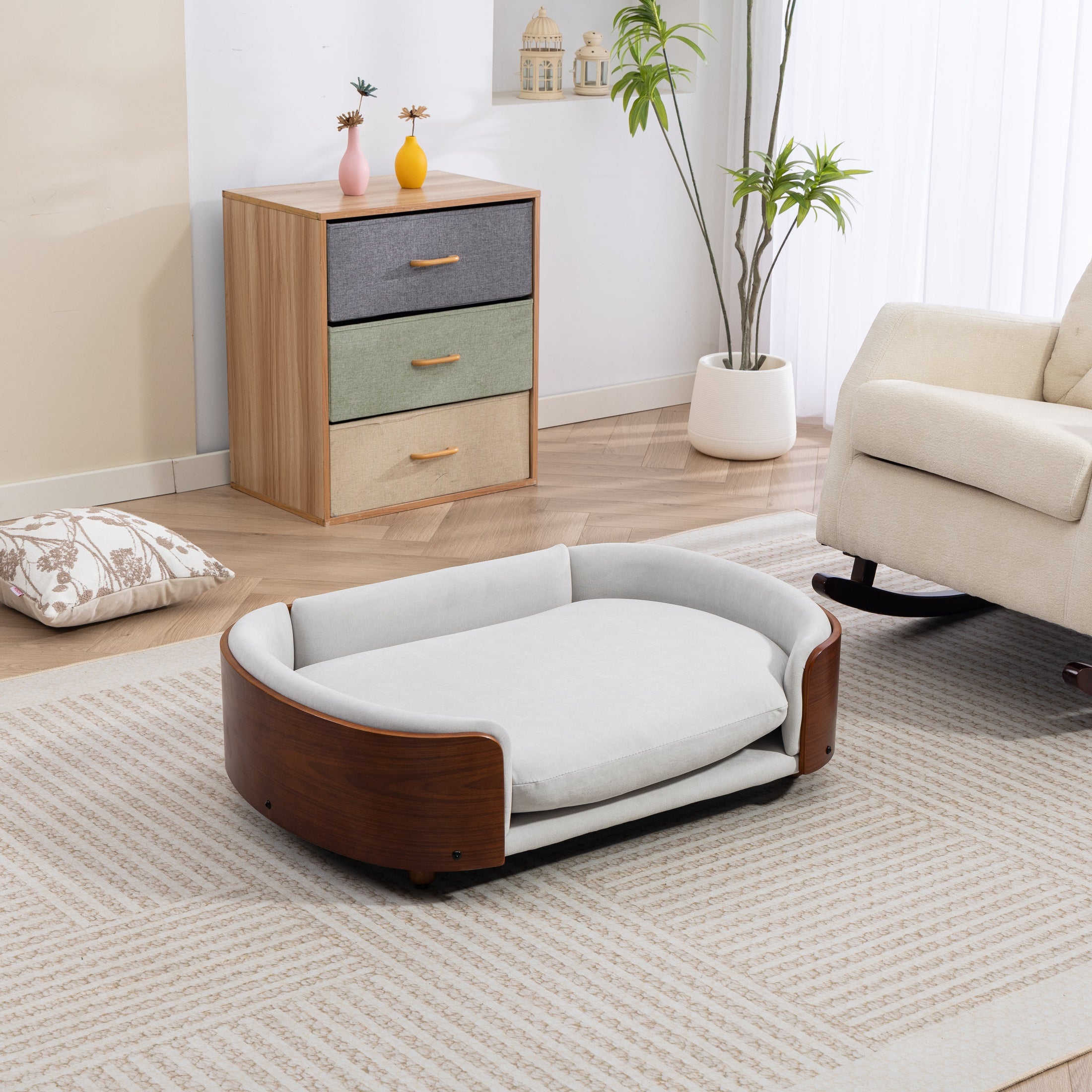 Scandinavian style elevated dog bed by Home Furnishers with solid wood legs and gray cushion