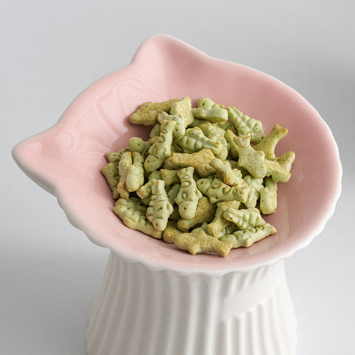 Pink ceramic cat-ear bowl filled with food