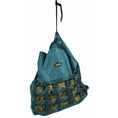 Bild in Galerie-Betrachter laden, Gatsby Nylon Scratchless Slow Feed Hay Bag by StateLineTack in teal, hanging with hay-filled mesh.
