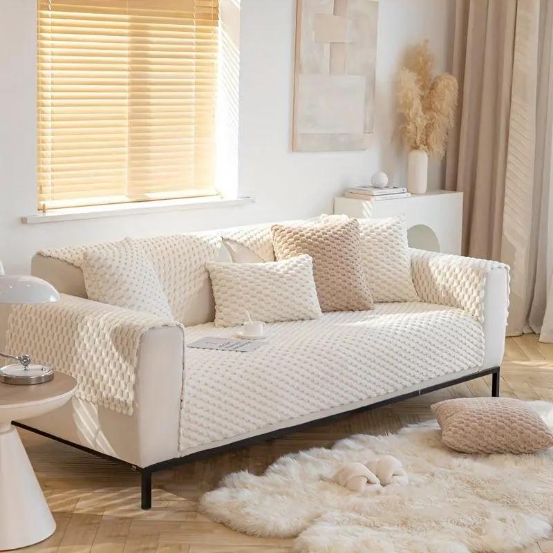 Plush Nordic Sofa Slipcover on white sofa with cream knitted cover and beige cushions