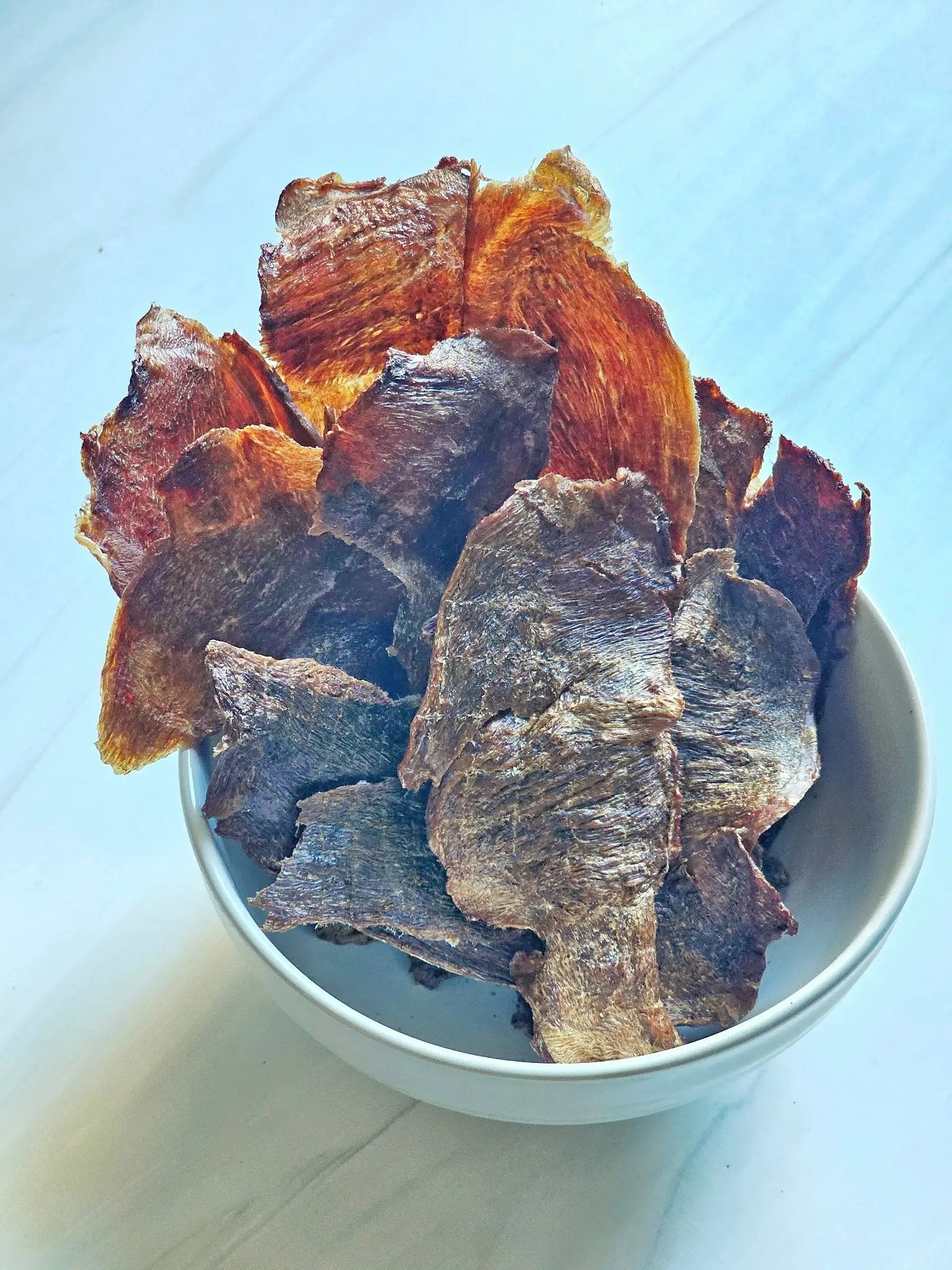 Naked Beasts Duck Breast ABF thin-cut fat-trimmed jerky slices in a bowl