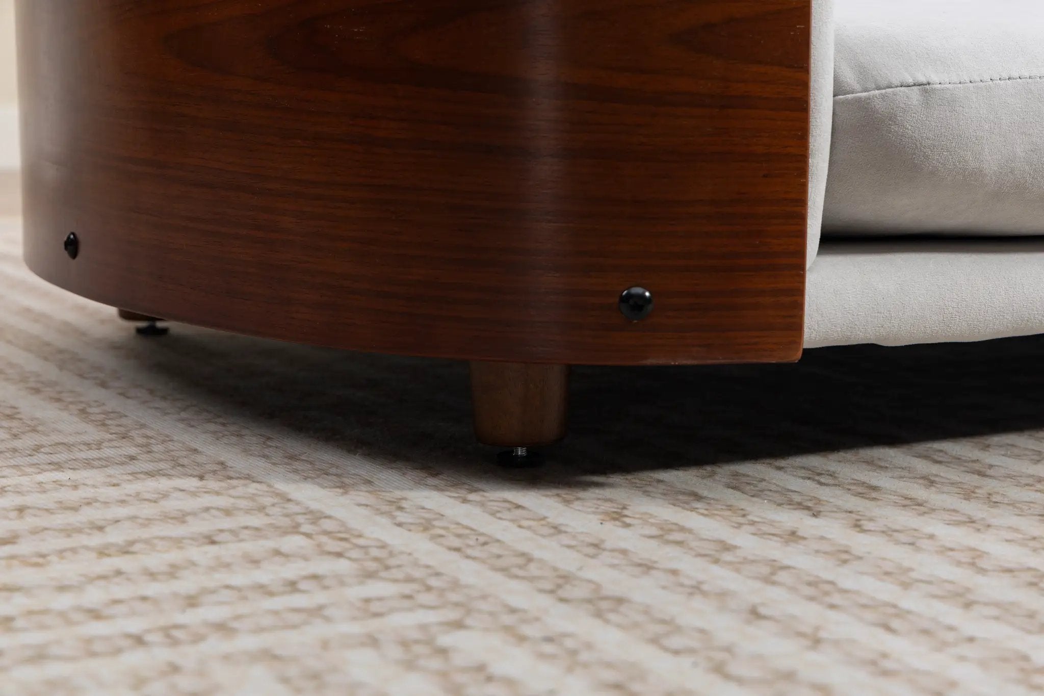 Scandinavian style elevated dog bed with solid wood legs and gray upholstery