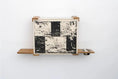Carica l'immagine nel visualizzatore della galleria, Deluxe Cat Cubby Bed wooden cube with black/white distressed checker front; side shelves and a metal bowl.
