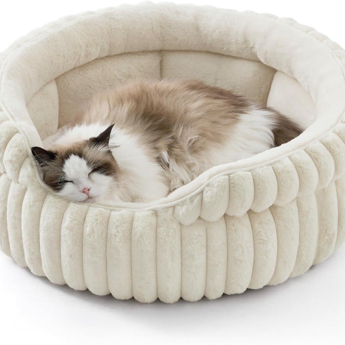 Cat curled inside cream ribbed bolster bed