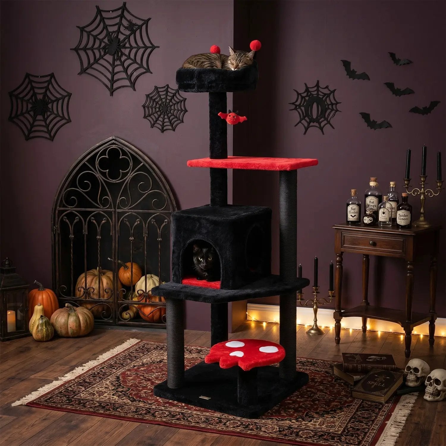 57-inch Gothic Cat Tower with padded red platforms, black posts, and a spider toy; cat resting on top