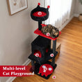Load image into Gallery viewer, 57-inch Gothic cat tower with padded red perch and hanging spider toy on a black multi-level cat tree.
