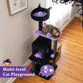 Load image into Gallery viewer, 57-Inch Gothic Cat Tower by DirectDeals with black posts, purple padded perches, and a hanging spider toy.
