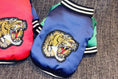 Bild in Galerie-Betrachter laden, Tiger-head embroidered dog jackets, blue and red with striped cuffs; 2-pack.
