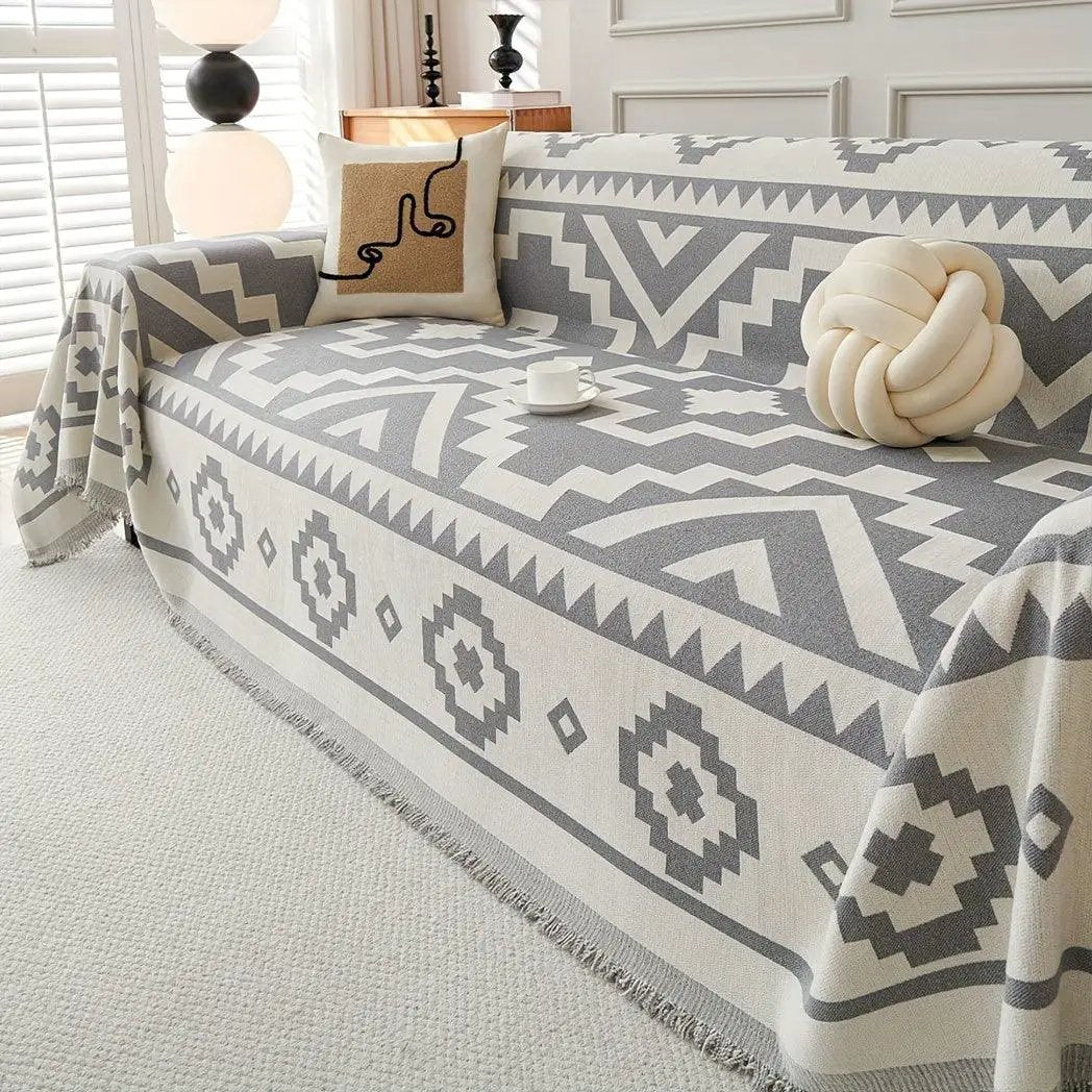 Boho-Chic All-Season Sofa Cover by topspet in light gray with geometric pattern