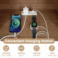 Cargar la imagen en la vista de la galería, Cat Litter Box Enclosure with LED Light & Charging Station; iPhone and Apple Watch charging on a white power strip
