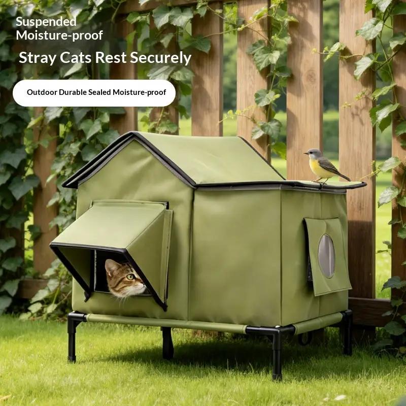 Pet Zen outdoor cat bed in olive green with a legged frame and side window, cat peeking out
