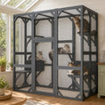 Load image into Gallery viewer, Outdoor cat enclosure, large gray metal-framed with mesh panels; multiple cats inside.
