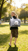 Charger l'image dans la visionneuse de la galerie, Mr. Peanut's Monterey Series airline-compliant gray backpack pet carrier with a small white dog peeking out.
