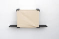 Carica l'immagine nel visualizzatore della galleria, Cat Cubby for Wall - Covered Cat Bed, beige fabric cube with black metal brackets.
