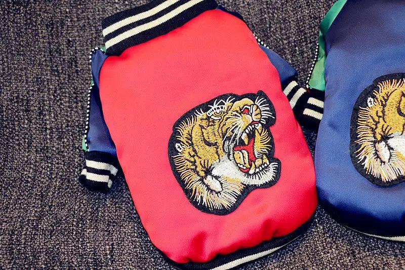 Dog jackets: two red and blue bomber-style jackets with tiger head embroidery.