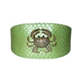 Load image into Gallery viewer, Sea Anemone Pearl Green snakeskin wide cuff bracelet with rhinestone crab centerpiece
