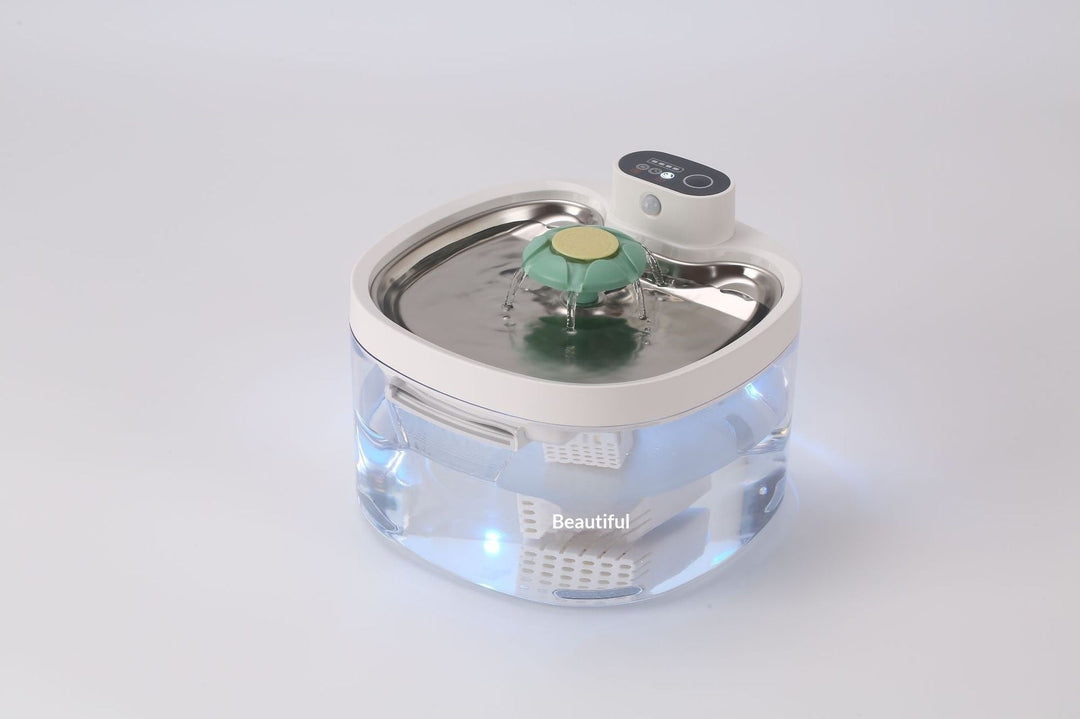 Clear fountain with green and yellow flower outlet