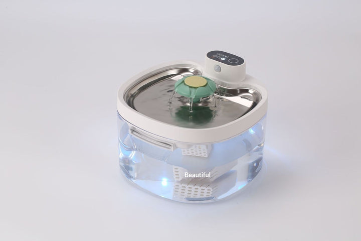 Clear fountain with green and yellow flower outlet