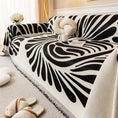 Load image into Gallery viewer, Versatile Chenille Sofa Cover with black-and-white zebra pattern and fringe trim on a sofa
