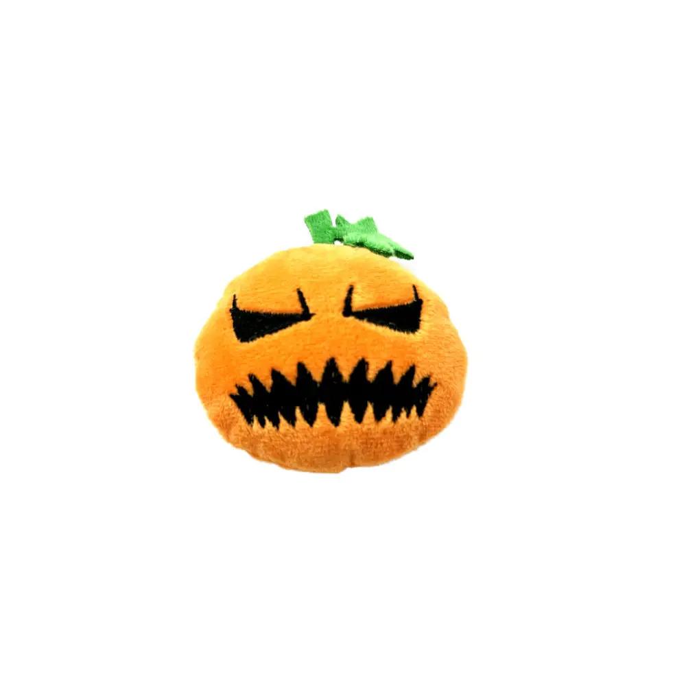 Orange plush pumpkin Halloween cat toy with a black jagged mouth, closed eyes, and green stem.