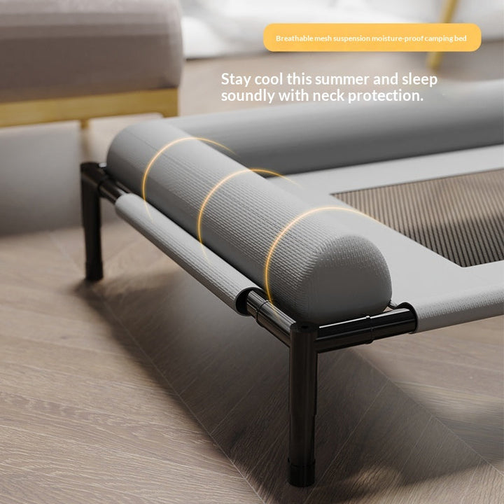 Close-up of gray bolster and mesh cot surface