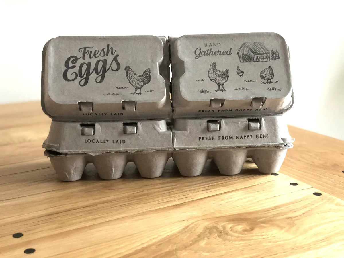Pair of split-apart egg cartons holding 6 or 12 extra-large eggs; kraft packaging with farm illustrations