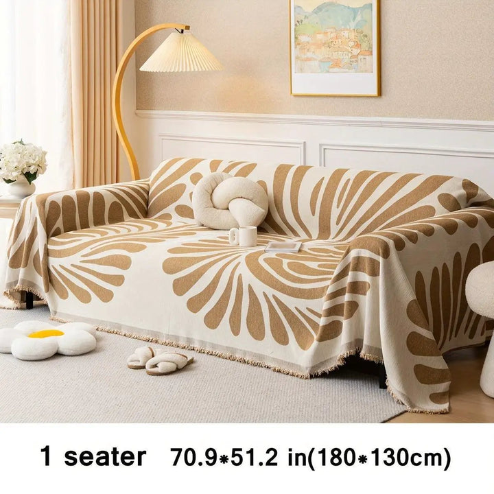 Versatile chenille sofa cover for 1 seater; cream with orange-brown abstract pattern