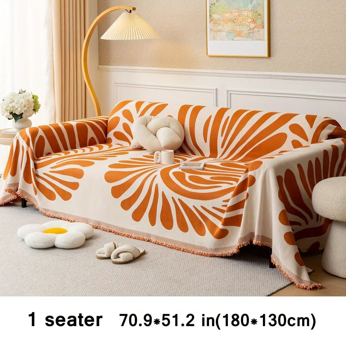 Versatile chenille sofa cover in orange and white abstract pattern for a 1-seater sofa.