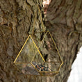 Load image into Gallery viewer, Open Air Glass Bird House by GreaterGood, two gold geometric hanging bird feeders with glass panels and seed.
