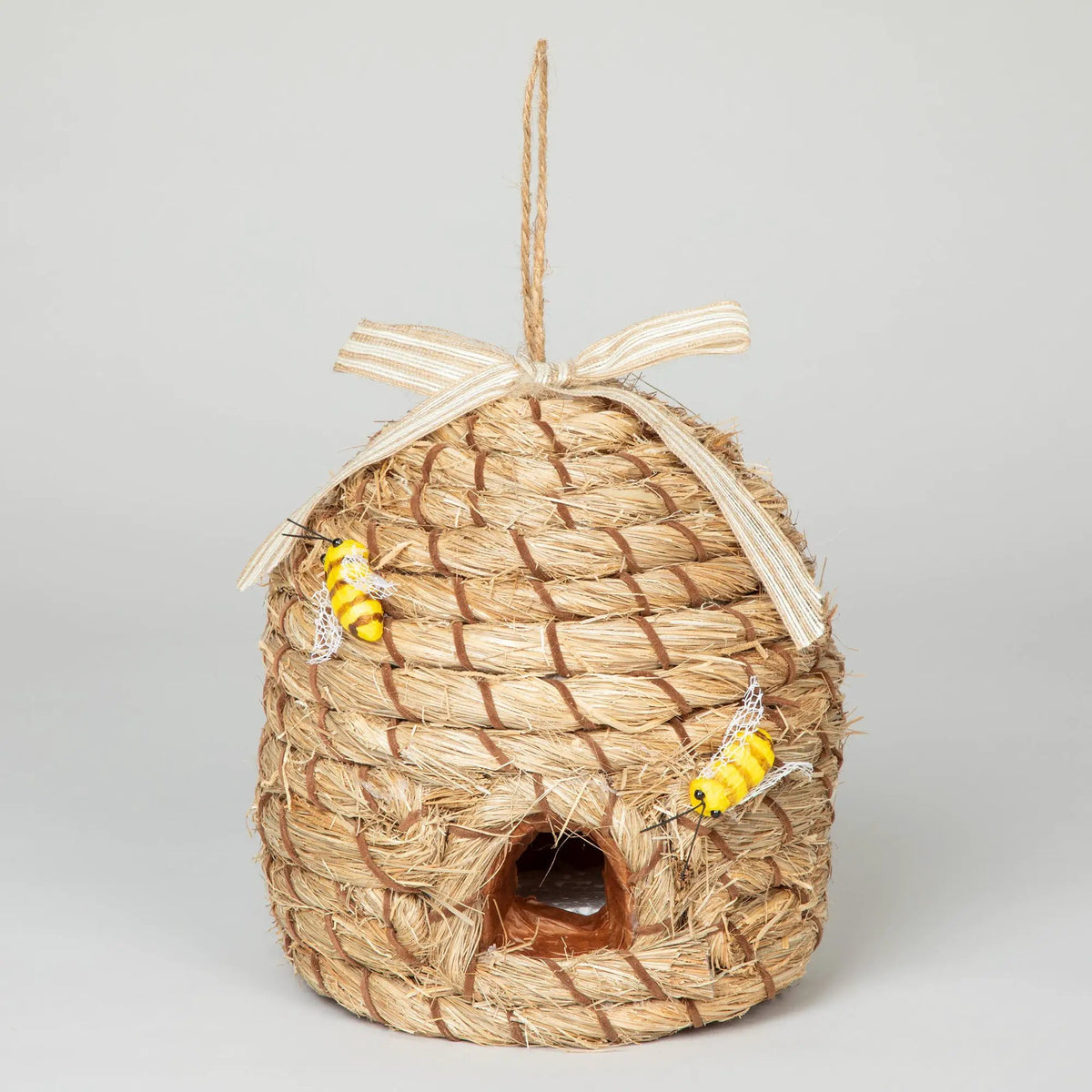 Beehive birdhouse, woven straw backyard habitat with rope hanger and ribbon bow.