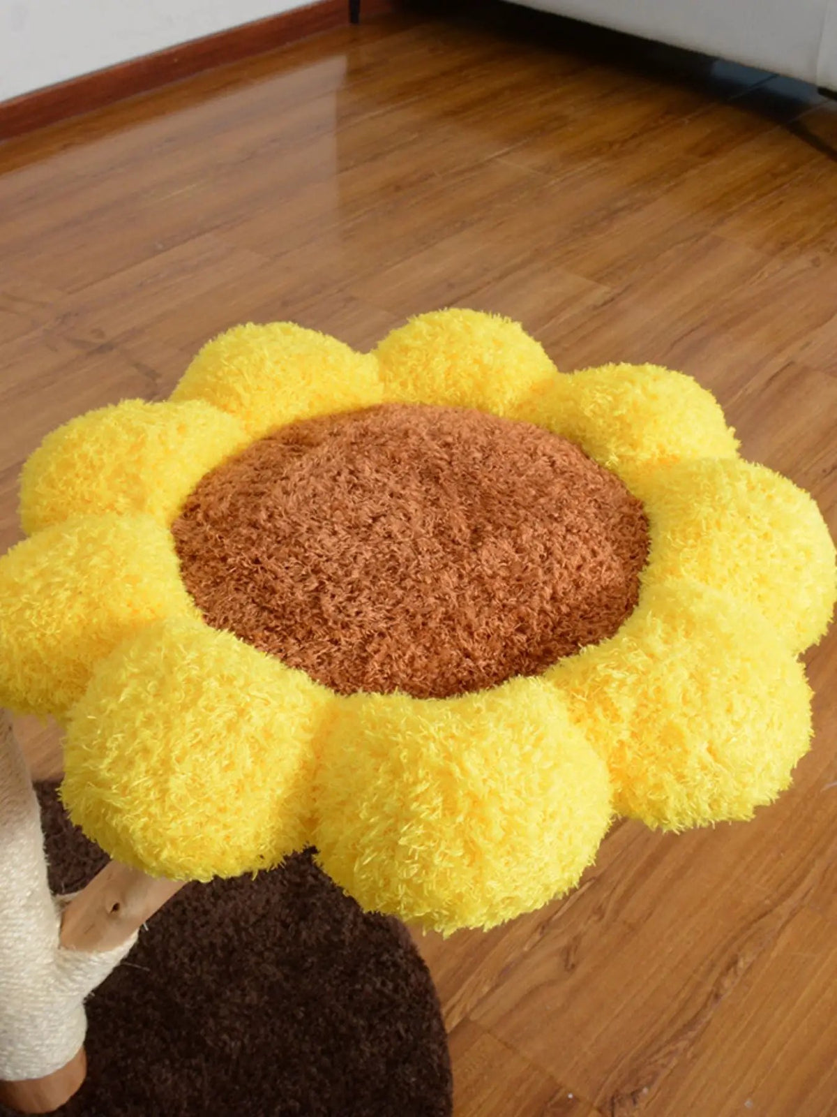 Sunflower multi-level cat tree and condo; yellow plush petals surround a brown center.