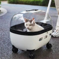 Carica l'immagine nel visualizzatore della galleria, Transparent capsule pet travel trolley carrier with wheels, white base and clear dome showing a cat inside.
