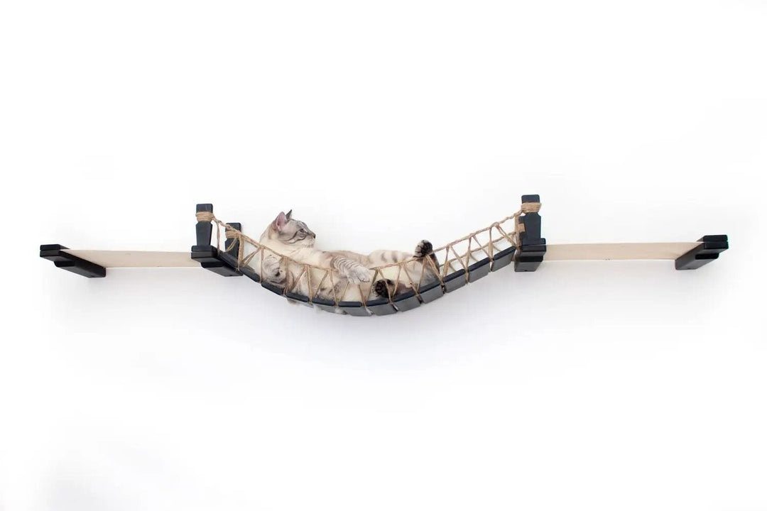 Double Cat Hammock and Climbing Bridge Combo; cat bridge in natural wood with rope net, one cat resting.