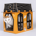Load image into Gallery viewer, Spooky Cat Haunted House Cardboard Cat Condo by Cat in the Box LLC; orange exterior with black windows and a cat inside.
