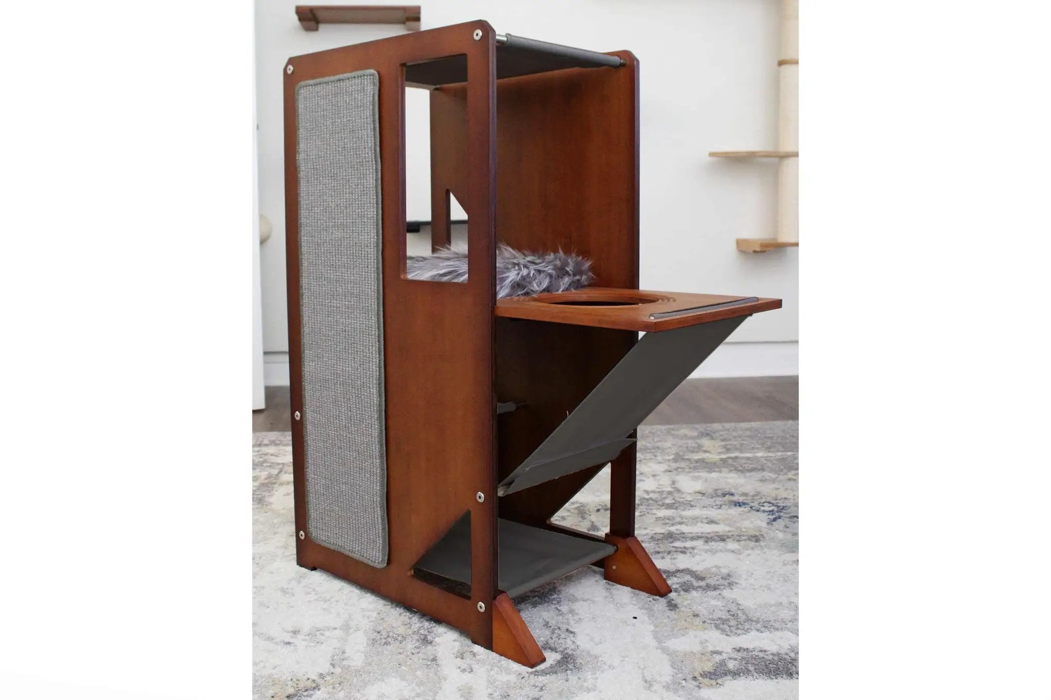 The Overlook bamboo cat condo by Catastrophic Creations, featuring a grey fabric scratch panel and elevated platform.