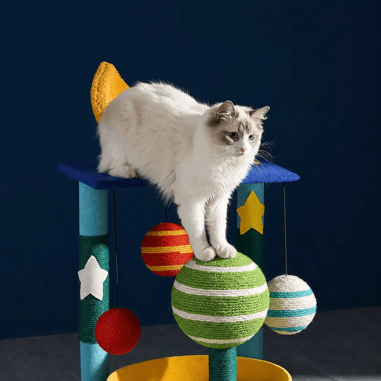The Starry Teddy Velvet Sisal Cat Climbing Tower with blue platform and colorful hanging balls.