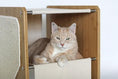 Load image into Gallery viewer, The Grotto cat condo, a short wooden cat tree with beige fabric shelf.
