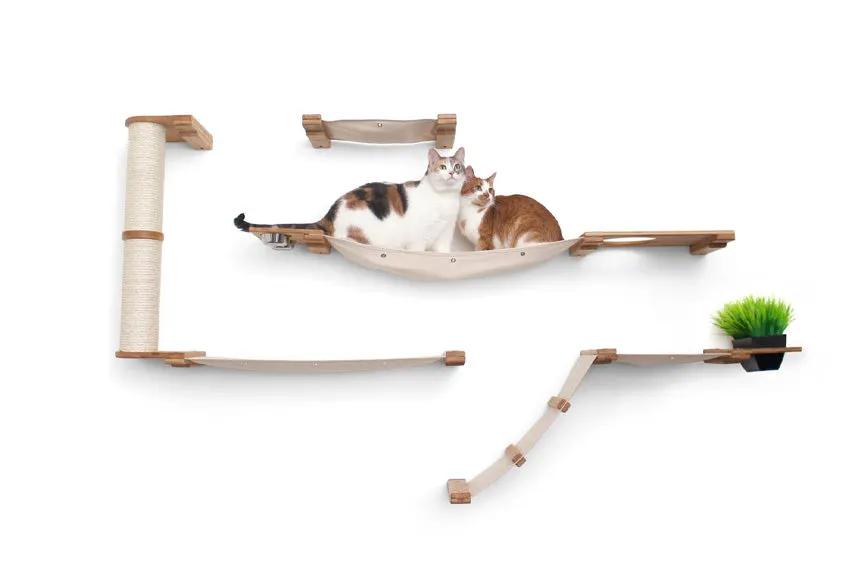The Bunker multi-level cat tree with perch by Catastrophic Creations; beige wood and sisal rope, two cats on hammock.