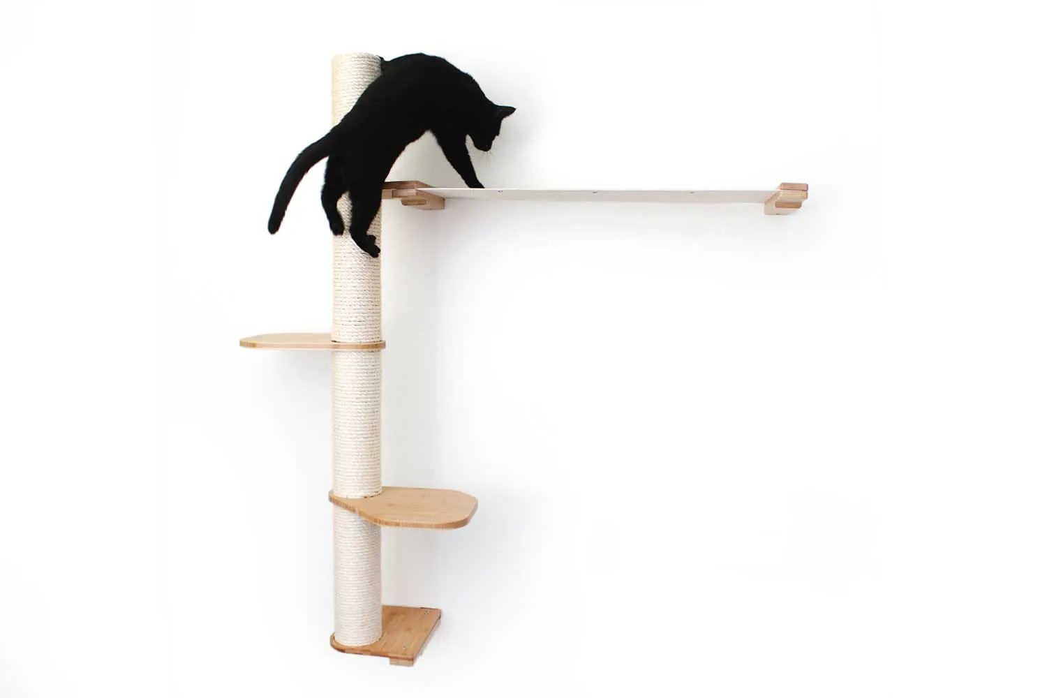 The Crow's Nest wall cat scratcher with hammock; natural sisal rope post and light wood shelves.
