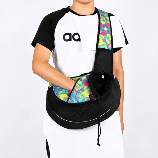 Breathable crossbody pet carrier for small dogs and cats, black with a colorful geometric strap.