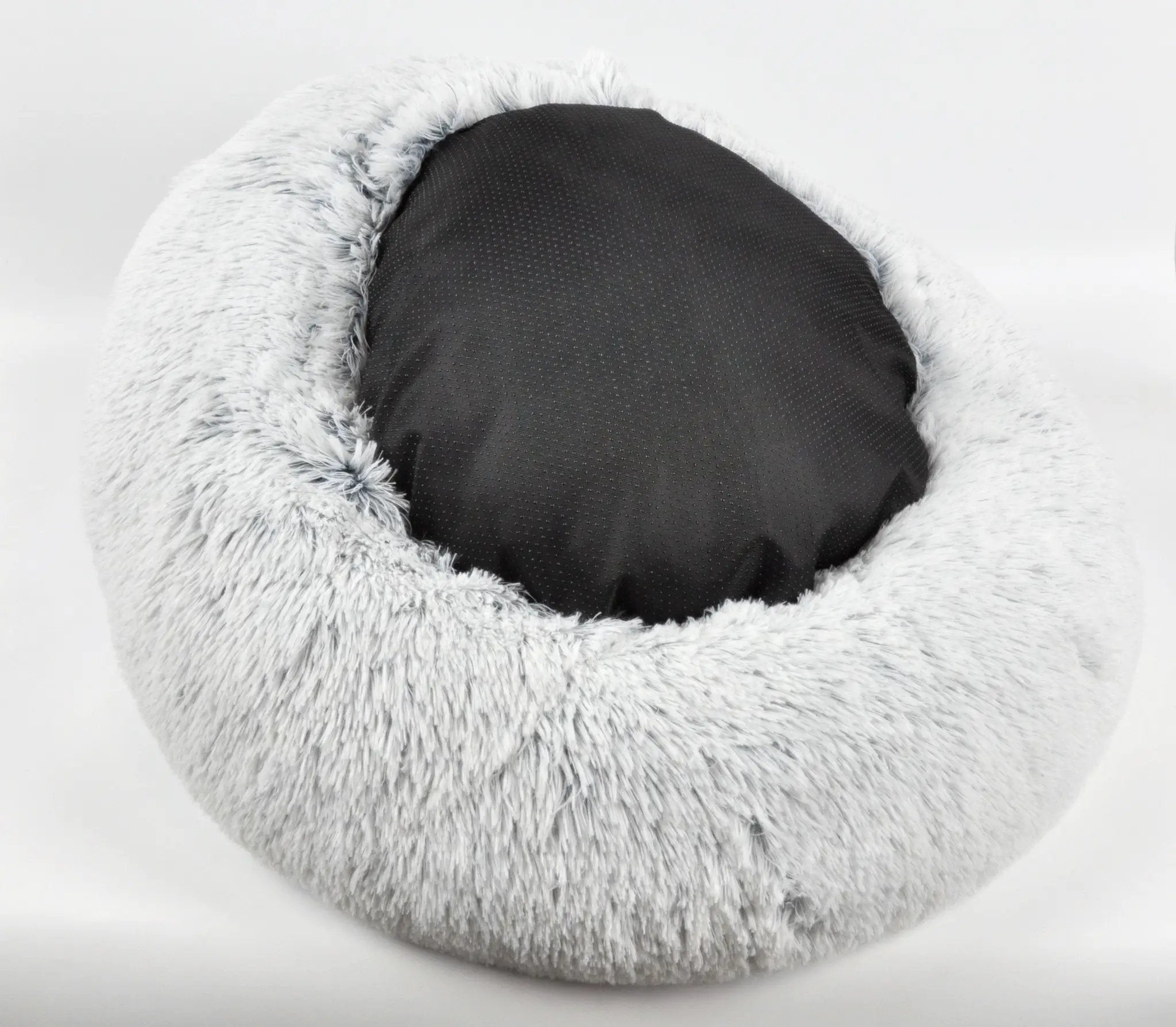 Mr. Peanut's 23-inch OrthoPlush Pet Bed, gray two-tone donut bed with fluffy light-gray rim and dark gray cushion.
