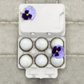 Load image into Gallery viewer, Egg carton with six jumbo white eggs, gray blank lid and a purple flower accent
