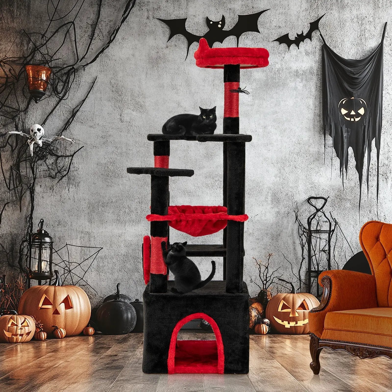 Gothic cat tree with black and red plush, spider-dangling toy; two cats perched.