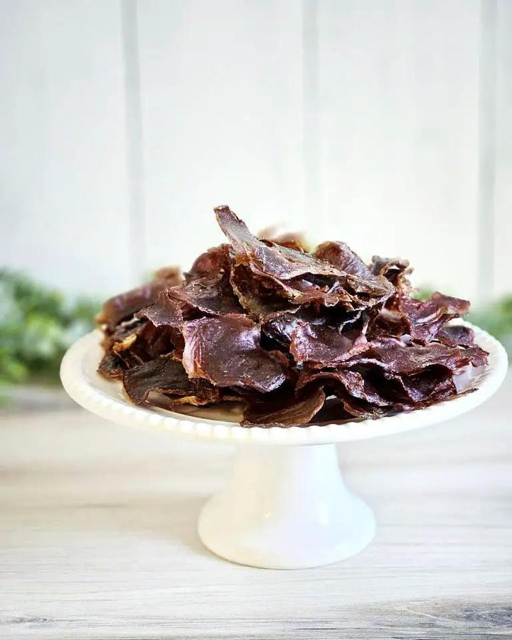Turkey Gizzard (ABF) Thin Cut from Naked Beasts on a white pedestal plate